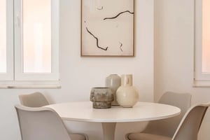 White table with chairs and vases dining area at Apartment in Rua do Passadiço, Lisboa for 70 m² with 1 bedroom in Lisbon Student Accommodation