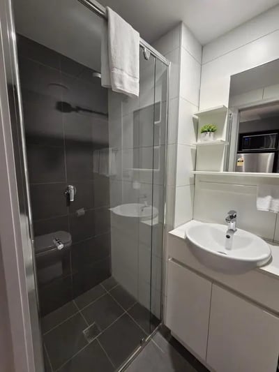 Modern bathroom with shower toilet sink. Bathroom at Sydney Student Living Top Ryde in Sydney Student Accommodation