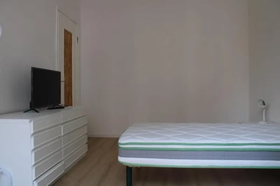 TV on dresser and mattress with lamp bedroom at Comfy single bedroom in Santa Lucia in Bergamo Student Accommodation