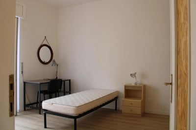 Bed desk chair lamp mirror nightstand bedroom at Comfy single bedroom in Santa Lucia in Bergamo Student Accommodation