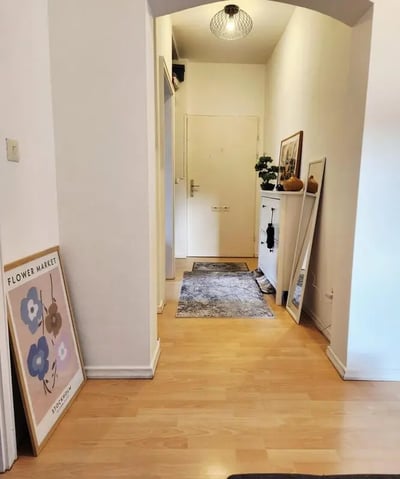 Artwork cabinet mirror and rugs hallway interior at Inviting double bedroom in a 4-bedroom apartment, in the Reinickendorf neighbourhood in Berlin Student Accommodation