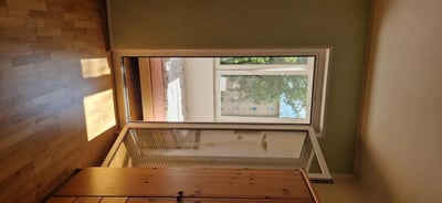 Wooden floor and cabinet overlooking exterior window living room at Bright 1-bedroom apartment close to the Richard-Wagner-Platz metro station in Berlin Student Accommodation