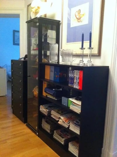 Bookshelves filled with books and magazines storage unit living room at Comfy double bedroom close to U Hohenzollernplatz metro station in Berlin Student Accommodation
