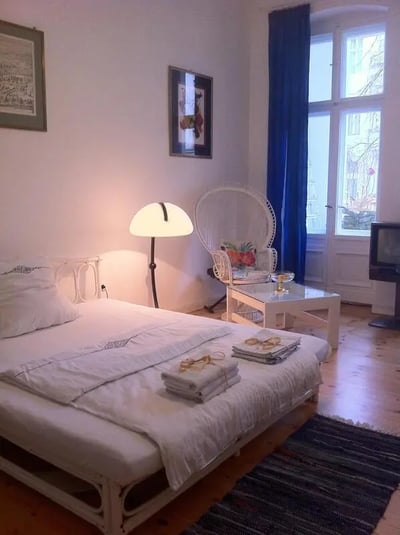 Bed lamp white chair small table bedroom at Comfy double bedroom close to U Hohenzollernplatz metro station in Berlin Student Accommodation