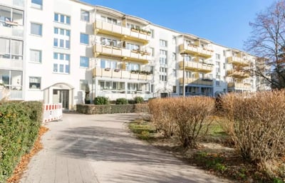 Apartment building with balconies and entrance exterior at Cozy single bedroom in a 4-bedroom apartment in Aldershof in Berlin Student Accommodation