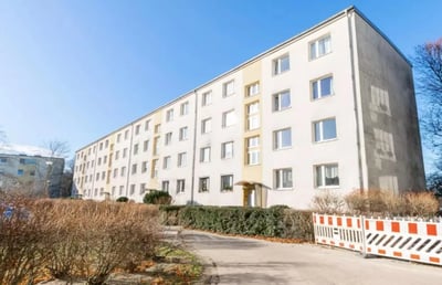 Apartment building exterior with many windows exterior at Cozy single bedroom in a 4-bedroom apartment in Aldershof in Berlin Student Accommodation