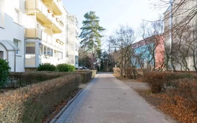 Apartment buildings with balconies and trees exterior at Cozy single bedroom in a 4-bedroom apartment in Aldershof in Berlin Student Accommodation