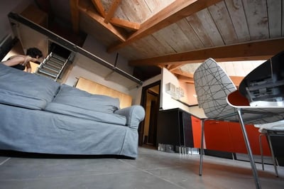 Sofa kitchen cabinets and chairs living room at Great-looking studio near Università degli Studi di Torino in Turin Student Accommodation