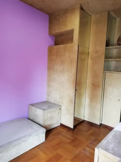 Bed and cube storage with mirrored wardrobe bedroom at Single bedroom "fil rouge", with balcony, in 5-bedroom apartment in Turin Student Accommodation