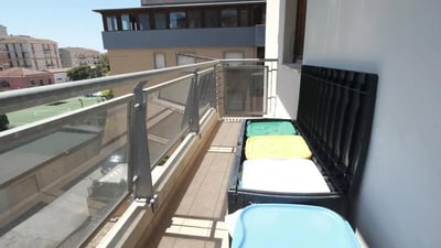 Bins with colorful lids on balcony exterior at Bright single bedroom in Cappuccini in Sassari Student Accommodation