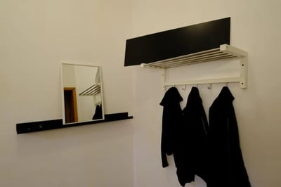 Mirror coat rack three jackets entryway at Delightful double bedroom in the heart of Sassari in Sassari Student Accommodation