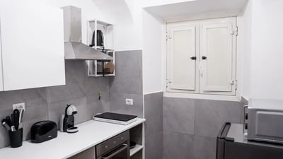 Toaster coffee machine electric hot plate kitchen at Cozy single bedroom in welcoming flat in Pigneto in Rome Student Accommodation