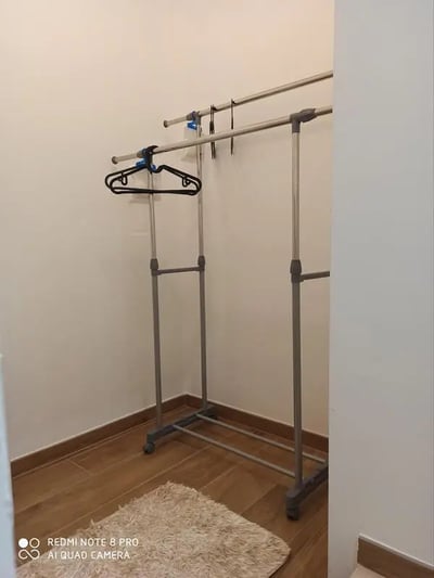 Clothes rack with rug bedroom area at Studio in Rome in Rome Student Accommodation