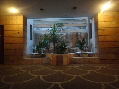 Stone walls plants and patterned pavement exterior at Bedroom in shared apartment in Rome Student Accommodation