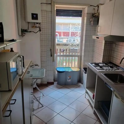 Microwave gas stove sink bins kitchen at Bedroom in shared apartment in Rome Student Accommodation