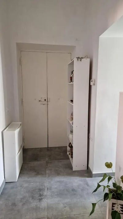 White shoe cabinet shelves double doors hallway at Double bedroomLa Sapienza - Tor Vergata - RBS in Rome Student Accommodation