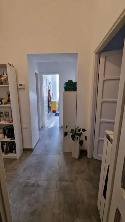 Hallway with doorway to bathroom and shelving Interior hall at Sunny double room La Sapienza - Tor Vergata RBS in Rome Student Accommodation