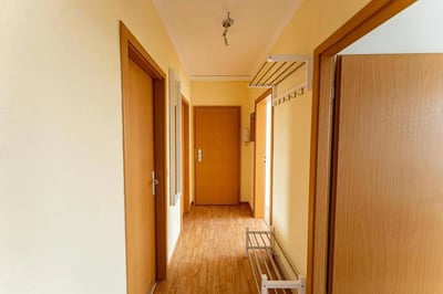Hallway with doors shoe rack coat hooks hallway at Very cosy single bedroom in Stern in Potsdam Student Accommodation