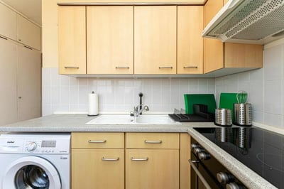Washing machine sink cabinets and stove kitchen at Very cosy single bedroom in Stern in Potsdam Student Accommodation