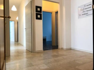 Hallway with doors and marble floor hallway at Large single bedroom in Mompiano in Brescia Student Accommodation
