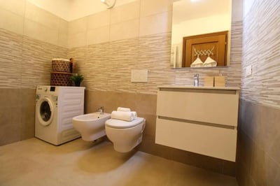 Washing machine bidet toilet and sink Bathroom at Charming single bedroom near Università Cattolica del Sacro Cuore in Brescia Student Accommodation