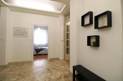 Hallway with artwork and visible bedroom interior hallway interior at Very cosy single bedroom near Parco dell'Acqua in Brescia Student Accommodation