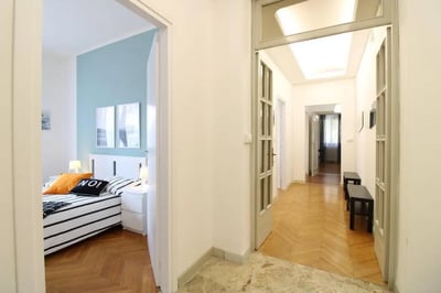 Bed with striped bedding and paintings Bedroom at Very cosy single bedroom near Parco dell'Acqua in Brescia Student Accommodation