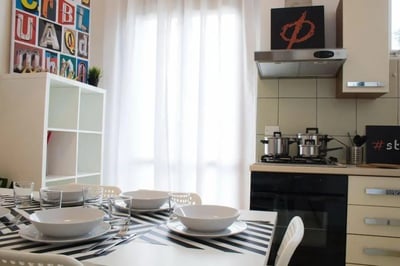Table setting with dishes and cookware kitchen at Snug single bedroom in Mompiano in Brescia Student Accommodation