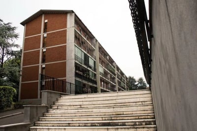 Brick apartment building with balconies and stairs exterior at Very nice single bedroom in Mompiano in Brescia Student Accommodation