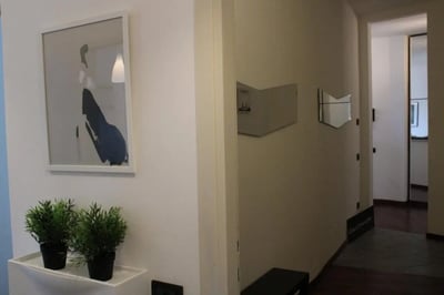 Painting plants mirror hallway hallway at Homely single bedroom near Facoltà di Medicina e Chirurgia in Brescia Student Accommodation