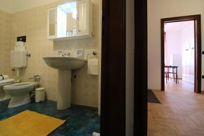 Toilet bidet sink and lockers exterior at Posh double bedroom near the Brescia train station in Brescia Student Accommodation