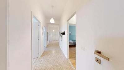 Hallway with doors and bedroom glimpse Bedroom at Very nice single bedroom near Facoltà di Medicina e Chirurgia in Brescia Student Accommodation