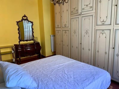 Bed dresser mirror large wardrobe bedroom at Large double bedroom close to the Trastevere train station in Rome Student Accommodation