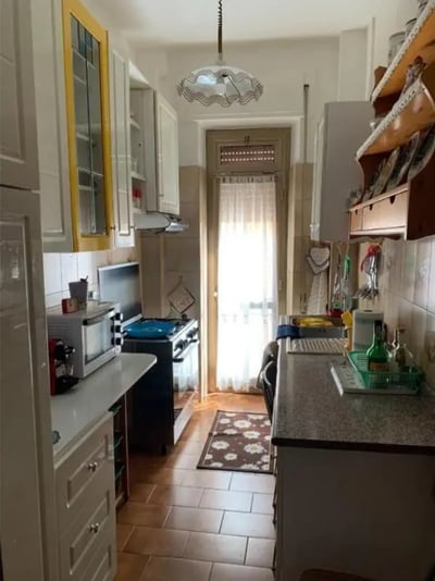 Kitchen with microwave stove and cabinets kitchen at Large double bedroom close to the Trastevere train station in Rome Student Accommodation
