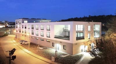 Modern student accommodation building with balconies and parking exterior at Inviting studio close to the Tübingen Derendingen train station in Tübingen Student Accommodation
