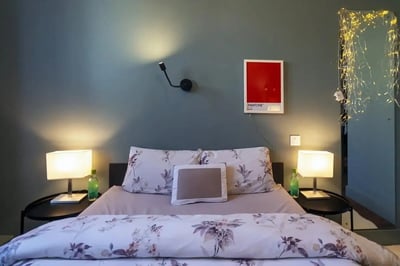 Bed with floral duvet bedside lamps and art bedroom at Copley Court in Cork Student Accommodation
