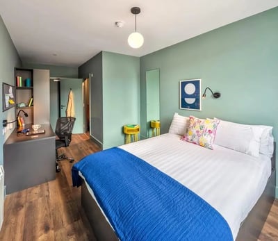 Bed desk chair and shelves bedroom at Copley Court in Cork Student Accommodation