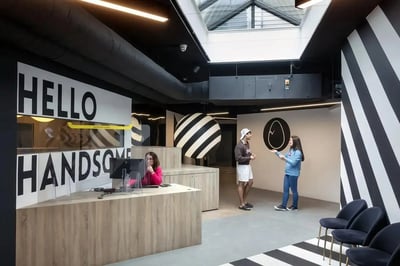 Reception desk with people and chairs interior at Copley Court in Cork Student Accommodation
