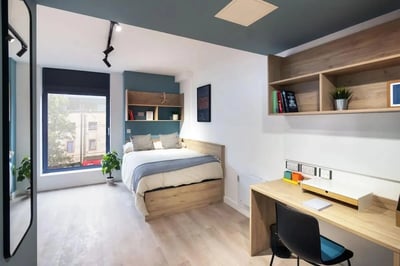 Bed with shelves desk and chair bedroom at Bradbury Place in Belfast Student Accommodation