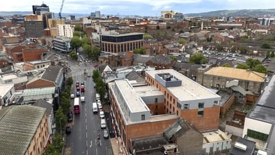Modern building with cars and city view exterior at Bradbury Place in Belfast Student Accommodation