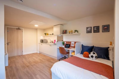 Bed kitchen desk basketball soccer ball bedroom at Valerian in York Student Accommodation