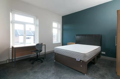 Bed desk chair near window Bedroom at 3 Bedroom House at 93, Gerald Road in Salford Student Accommodation