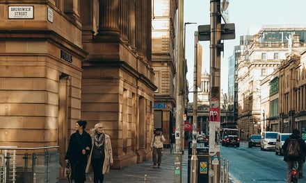 Street with people and buildings exterior at Glasgow Student Accommodation