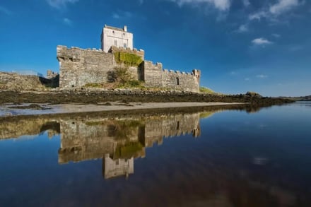 Stone castle with reflections on water exterior at Galway Student Accommodation