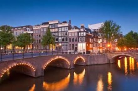 Amsterdam canal buildings bridge and water exterior at Amsterdam Student Accommodation