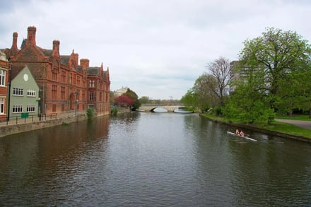River with buildings and rowing boat exterior at Cambridge Student Accommodation