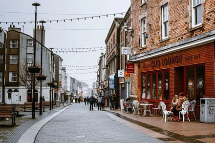 Street with cafes and people exterior at Exeter Student Accommodation