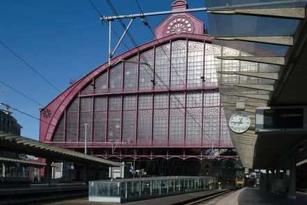 Large arched windows on pink building exterior