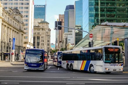 Buses at city intersection building exterior