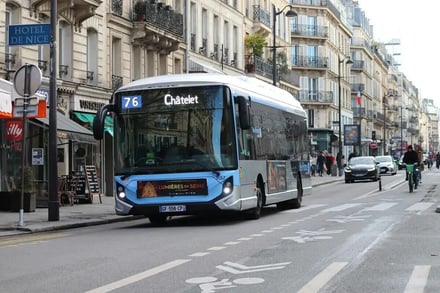 Bus on street with buildings and bike lane exterior